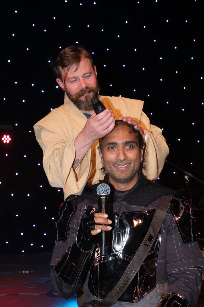 Amit having his hair cut at the ADI congress