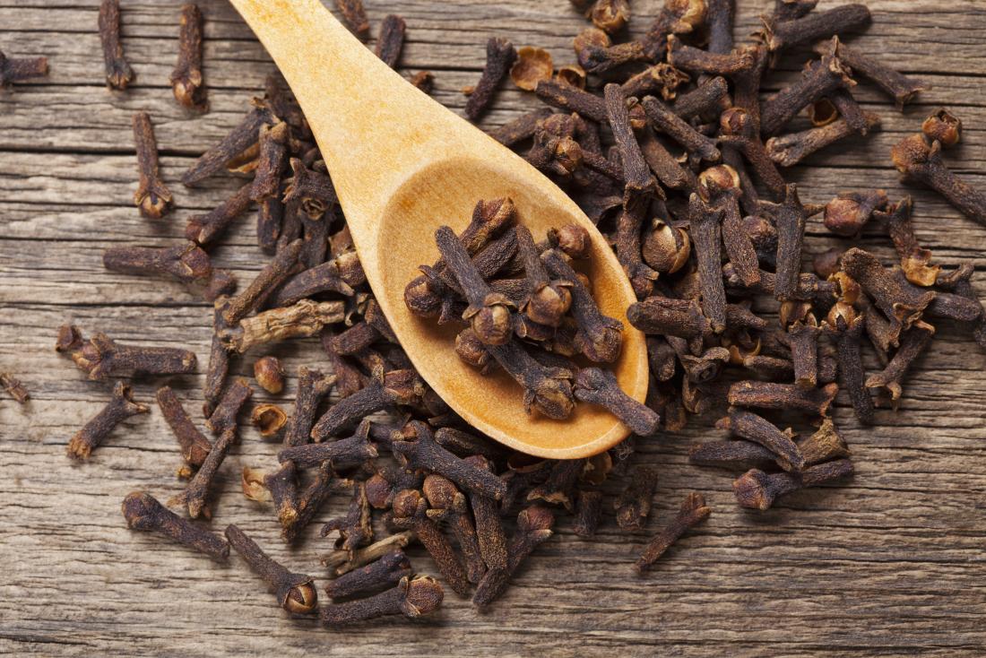 Cloves on a wooden spoon