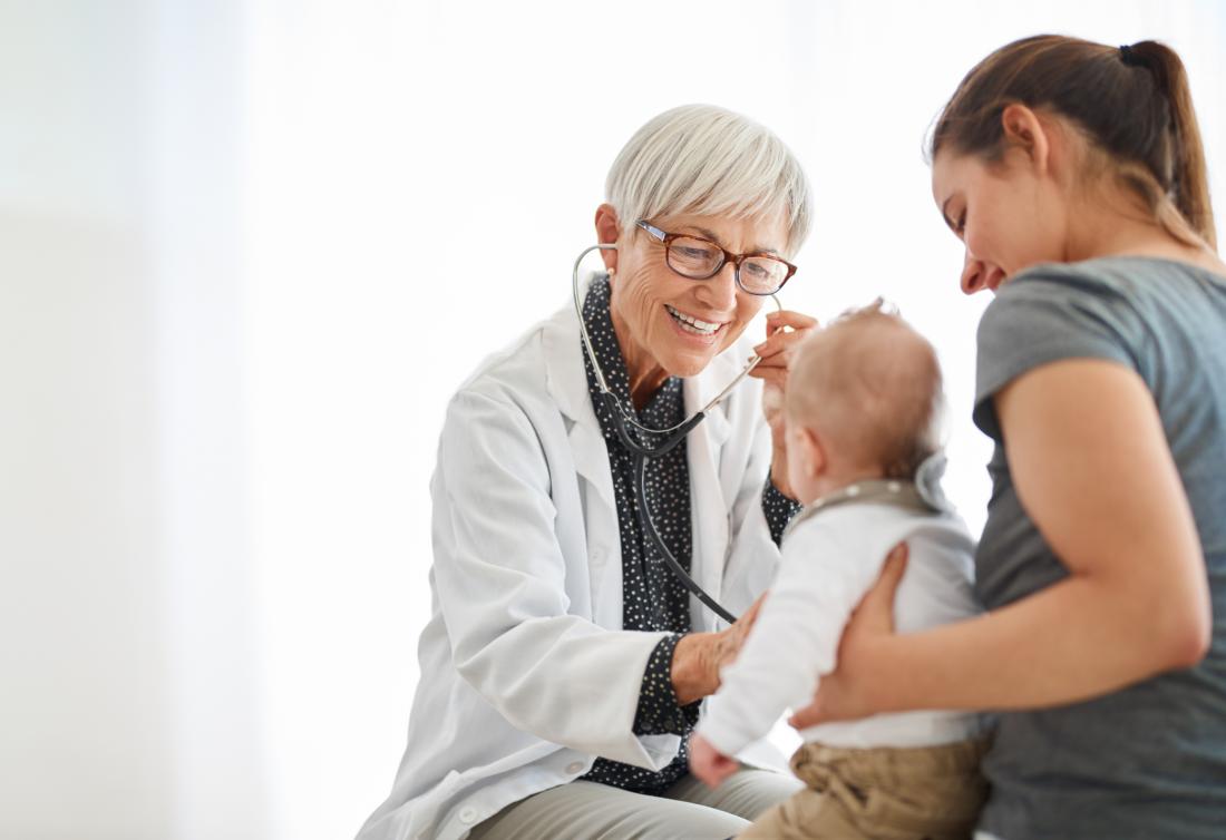 Doctor assessing a baby