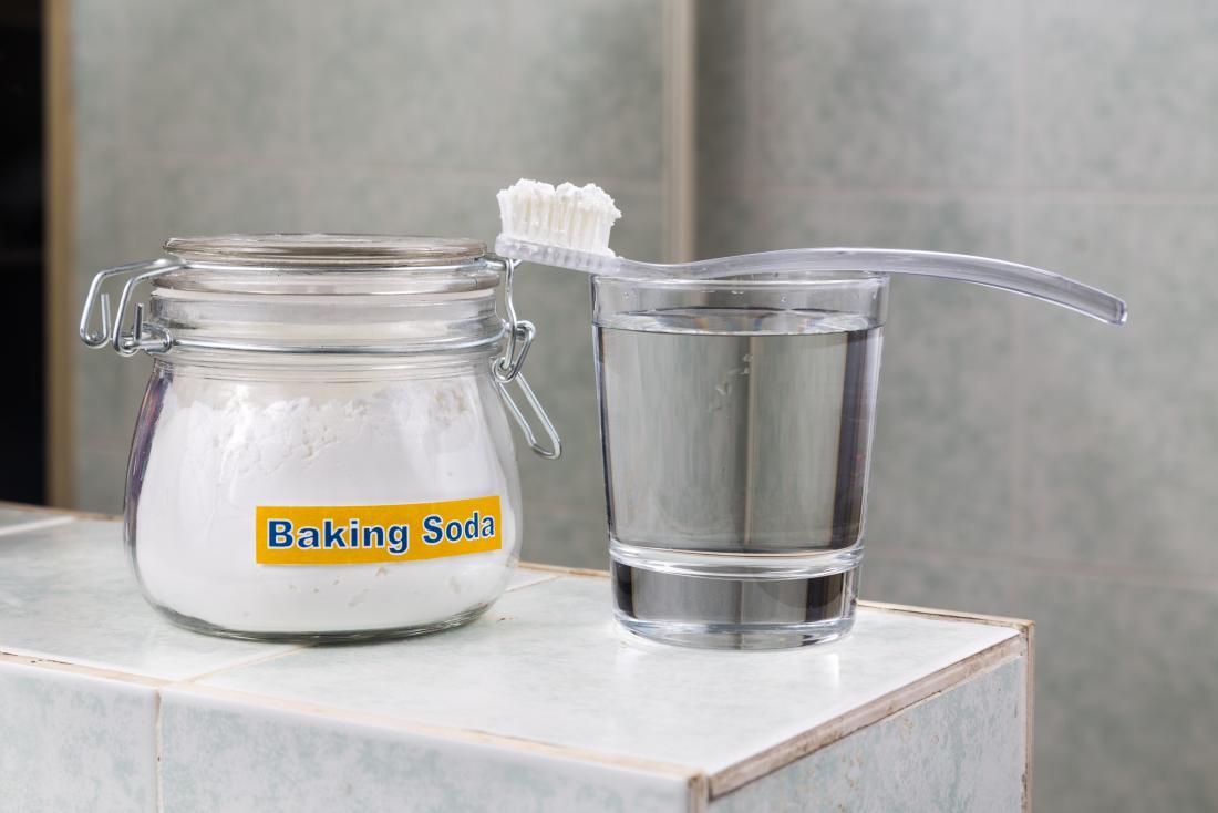 Tooth brush and baking soda which may help with brown spots on teeth