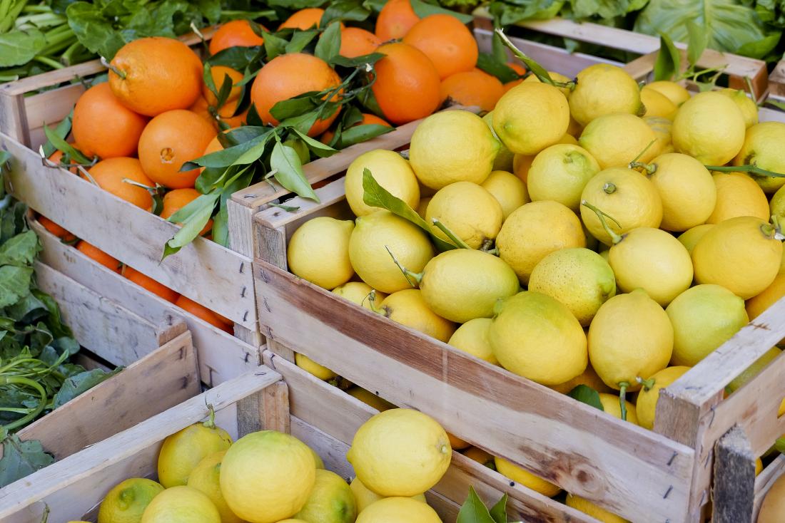 Wooden crates containing lemons and oranges.